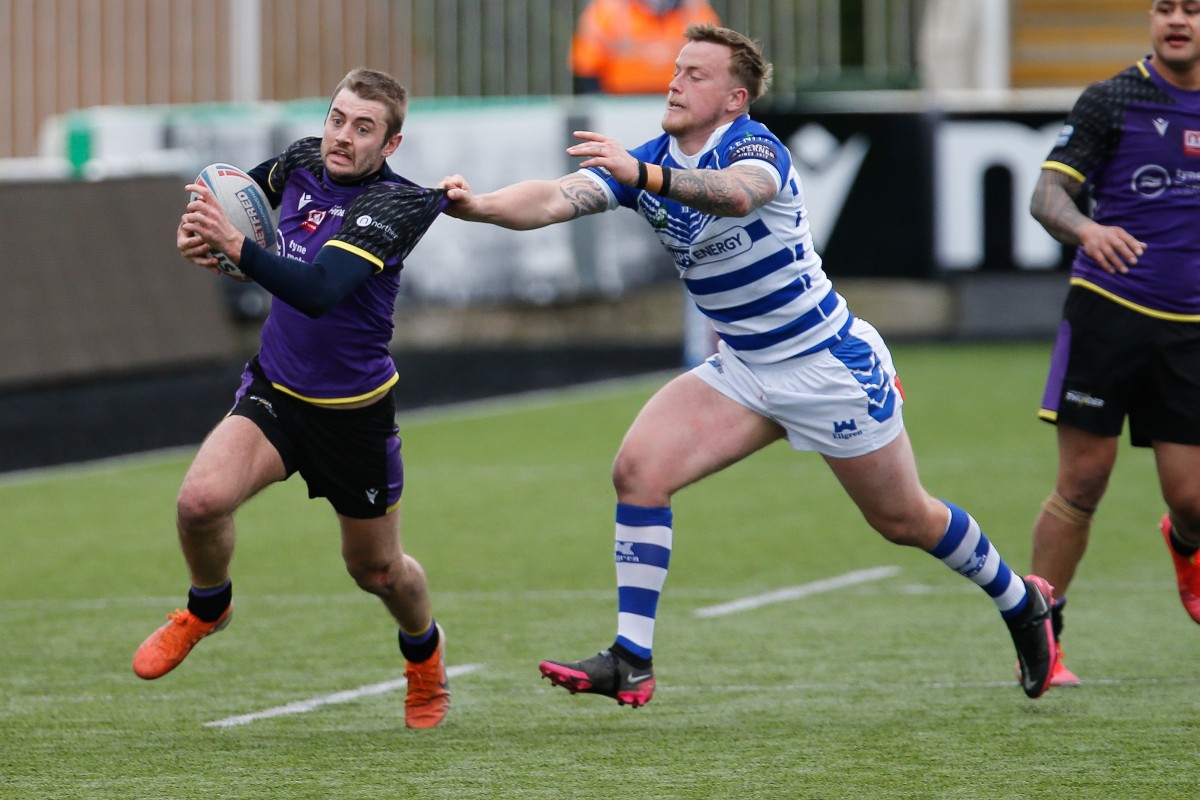 Lewis Young in action for Newcastle